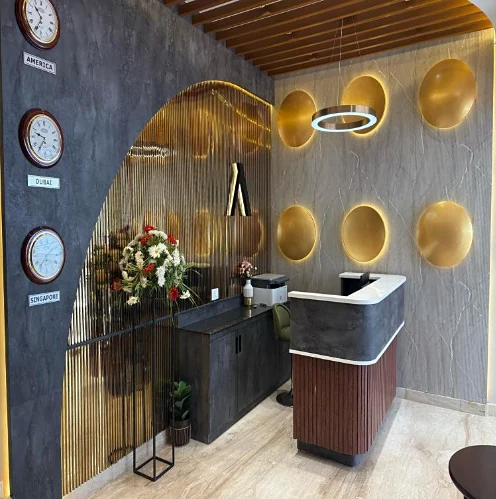 Embassy Park reception with gold wall panels and world clocks